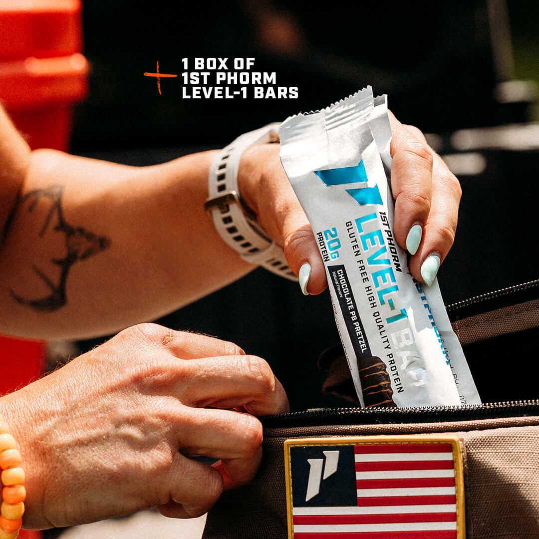 A person puts a 1st Phorm Level-1 protein bar into a bag with an American flag patch.