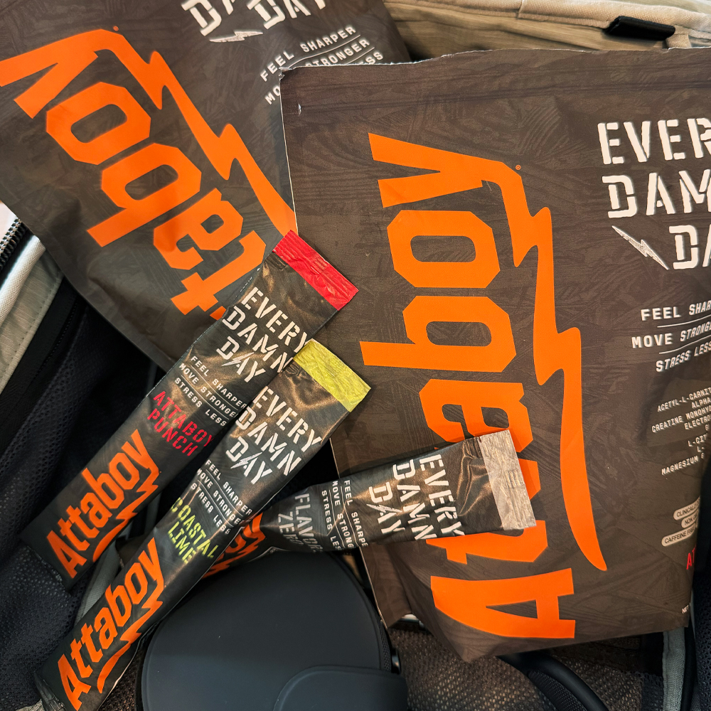 Close-up of packaged energy drink mix with bright orange branding.