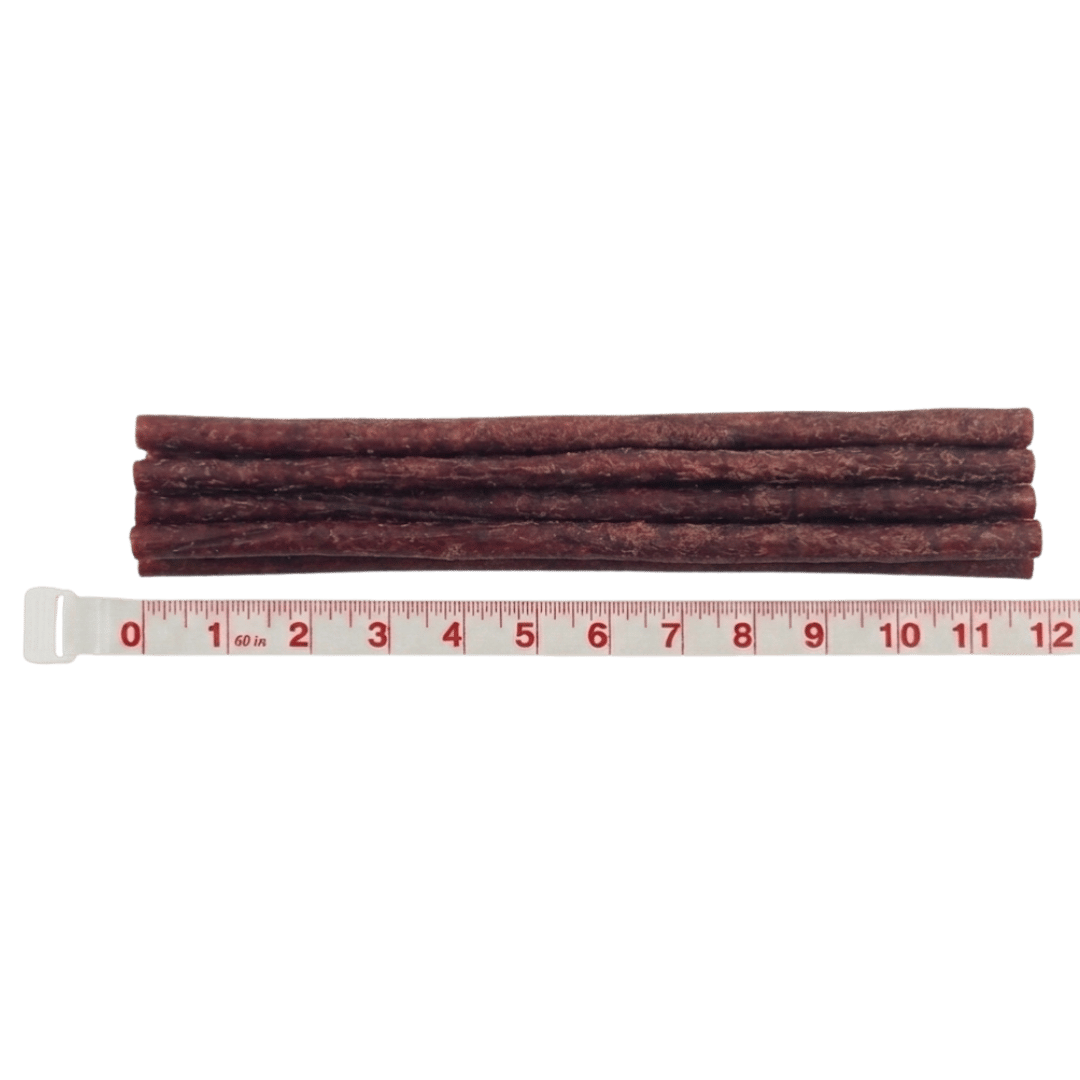 A stack of long, brown sticks laid next to a tape measure showing they are nearly 12 inches.