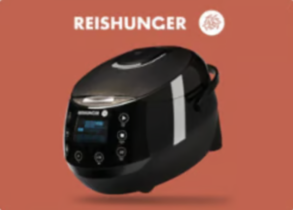A black Reishunger digital rice cooker on a green background.
