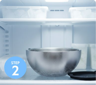 Metal bowl in a refrigerator next to labeled 'Step 2' icon.