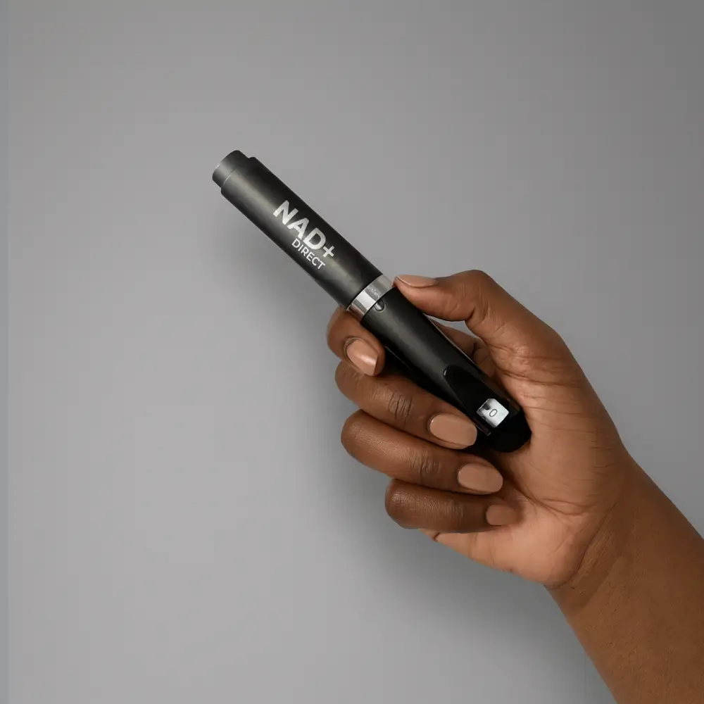 A hand holding a black device labeled 'NAD+ Direct'.