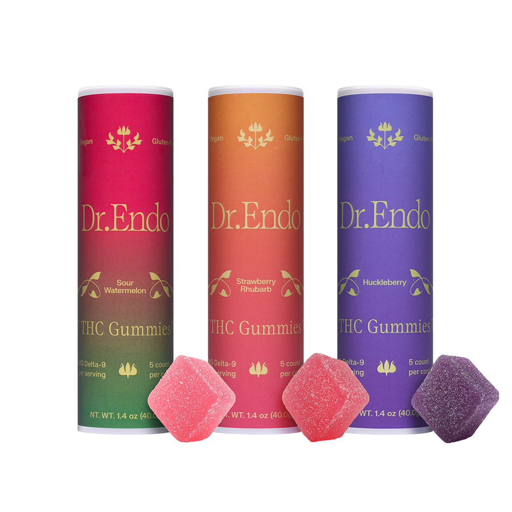 Three tubes of Dr. Endo THC Gummies in different flavors with three corresponding gummies in front.