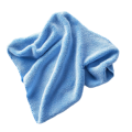 A crumpled blue microfiber cloth on a white background.