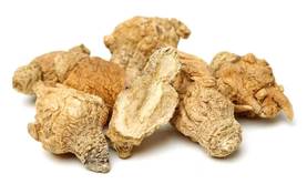 A pile of dried, brown root-like objects on a white background.