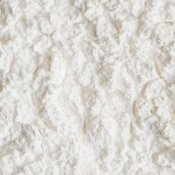 Close-up of a textured white powder surface.