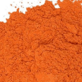 Close-up of a pile of orange powder.