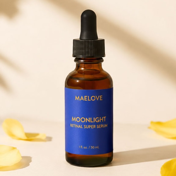An amber glass dropper bottle of Maelove Moonlight Retinal Super Serum sits among scattered yellow petals.