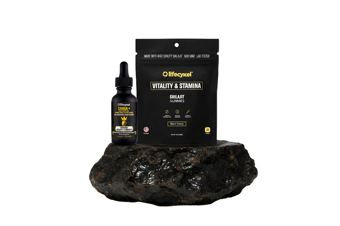 Bottle and pouch of supplements on a black rock.