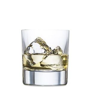 Glass of whiskey with ice cubes.
