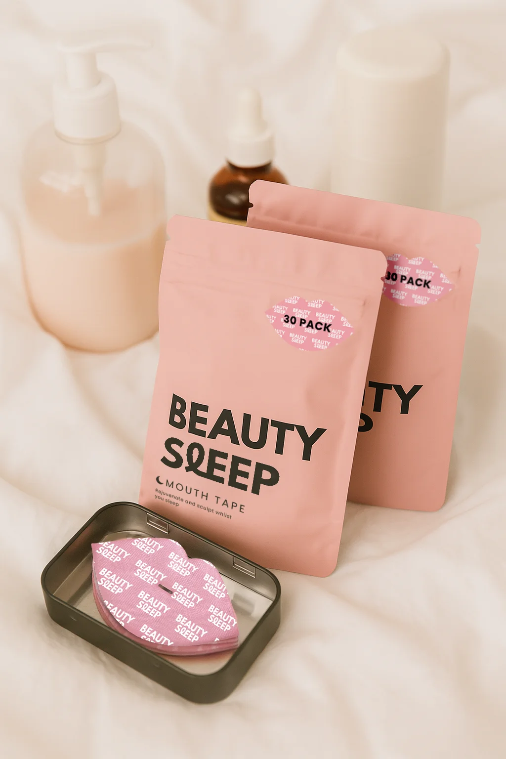 Pink beauty sleep mouth tape packages on a white surface.