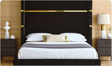 Modern bedroom with a dark bed, white bedding, and two nightstands with lamps.