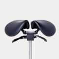 Black ergonomic saddle chair on a metal stand.