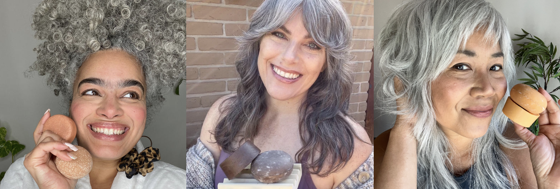Three women with gray hair holding round soap bars, smiling.