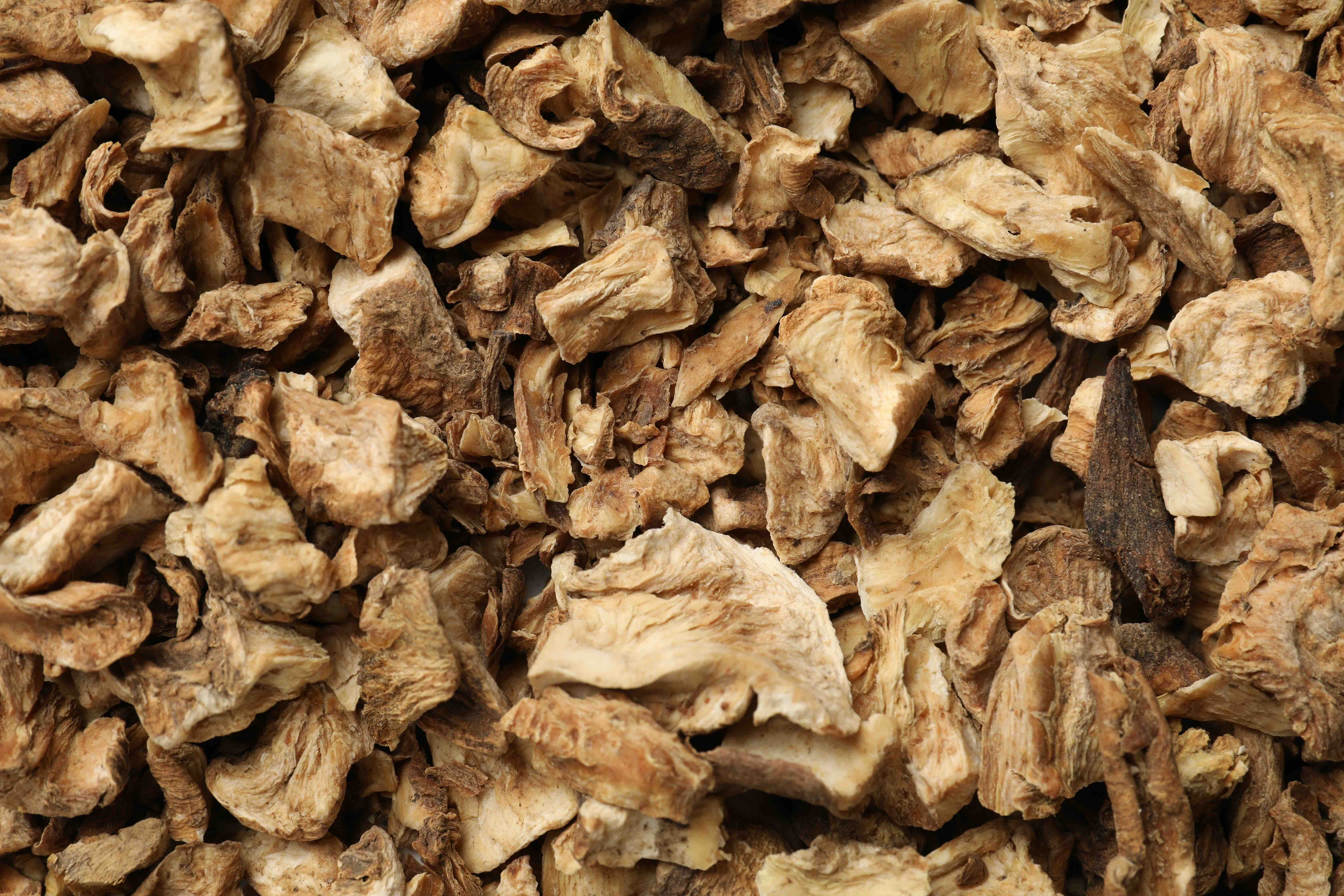 Close-up of dried, sliced root pieces piled together.