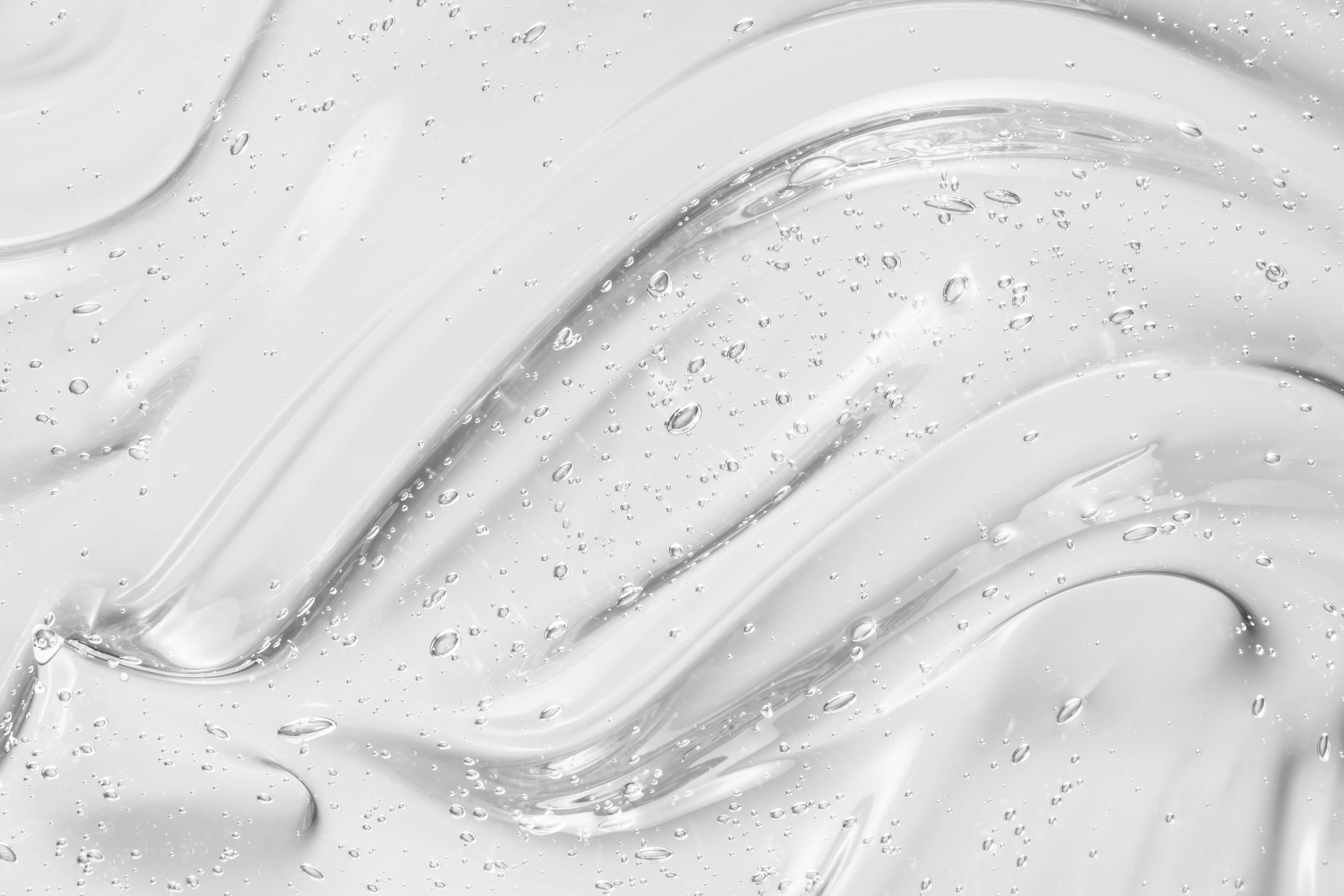 Clear gel texture with bubbles and smooth waves.