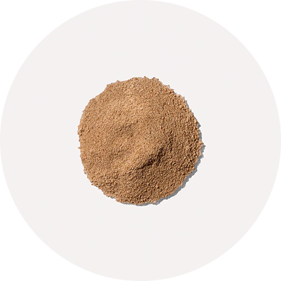 A pile of brown powder on a white background.