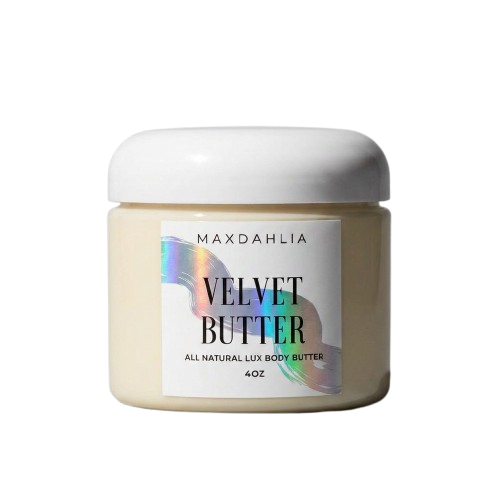 A white jar of Maxdahlia Velvet Butter, an all-natural lux body butter, against a white background.