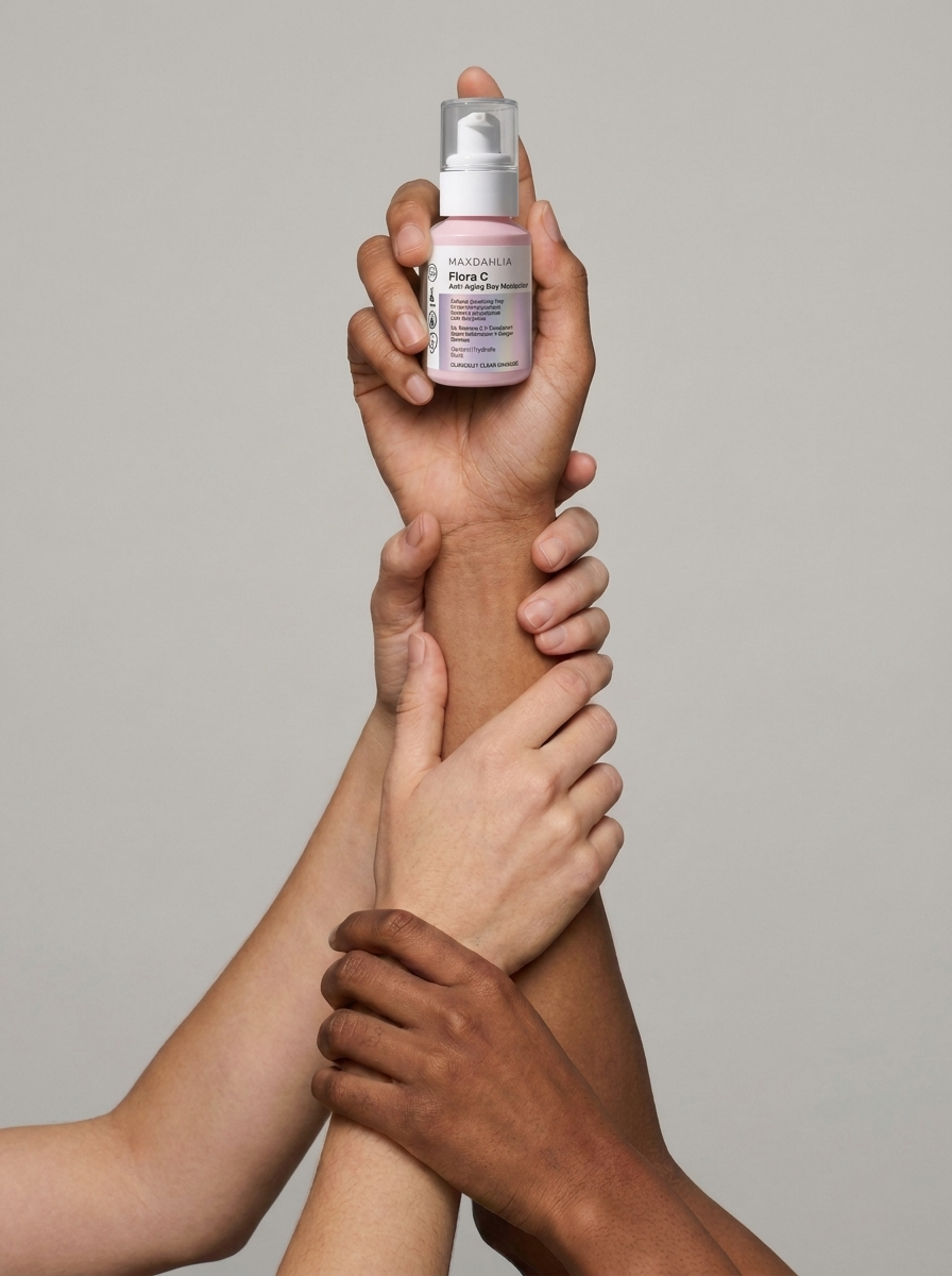 Multiple arms of diverse skin tones reach up, with one hand holding a pink bottle of moisturizer.