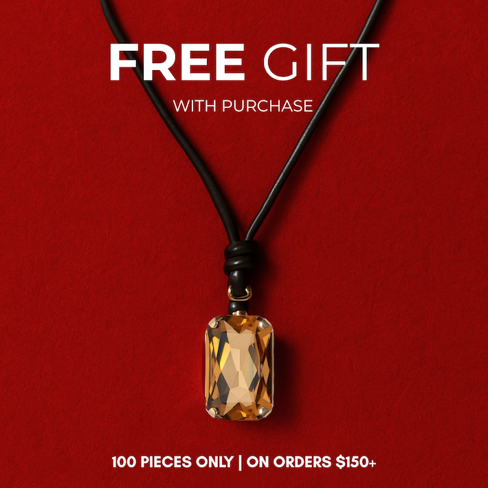 Rectangular amber pendant on black cord, red background, promotional text.