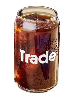 Cold brew in a glass with 'Trade' on the front.