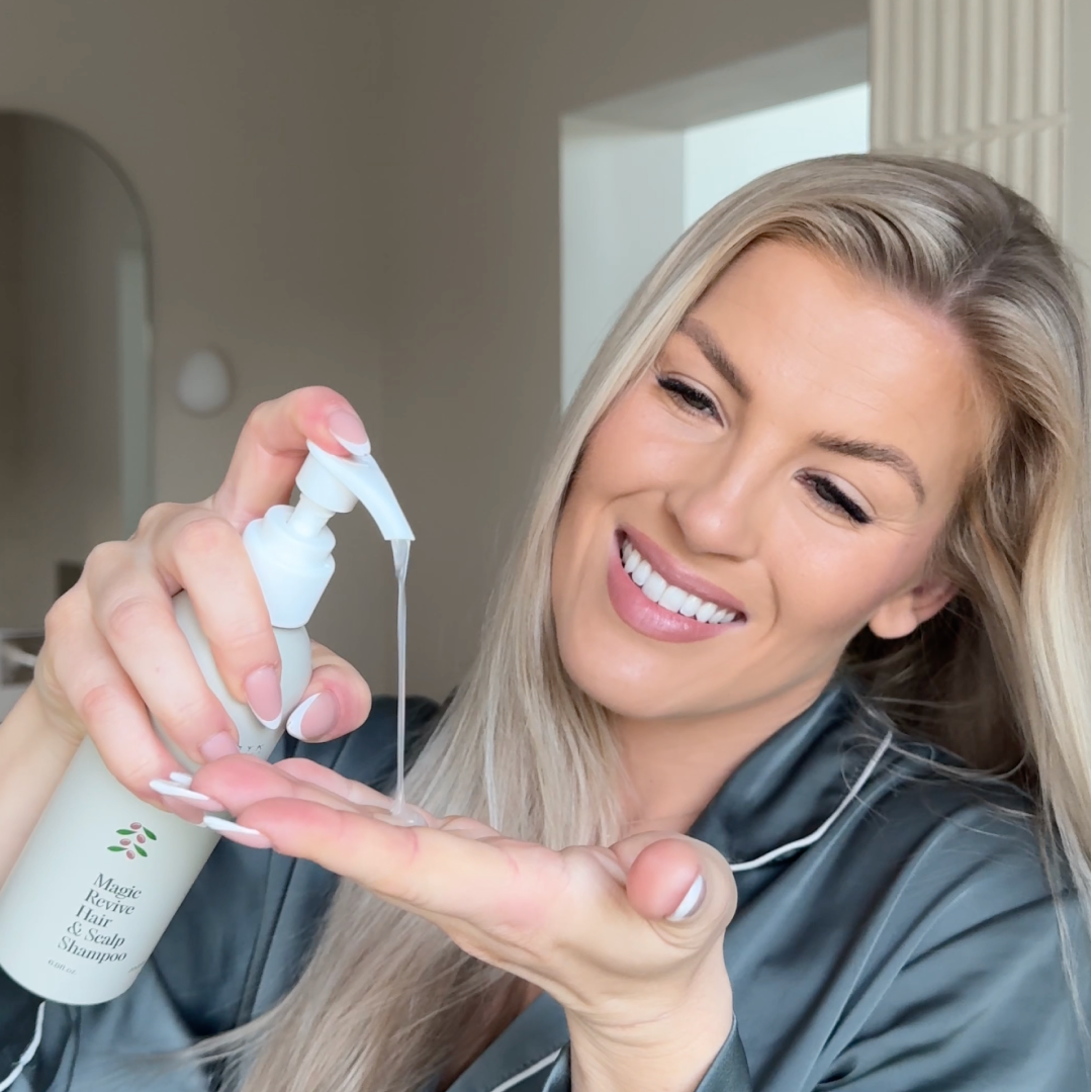 Person dispensing liquid from a pump bottle into their hand.