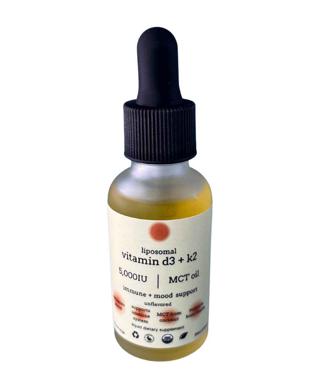 A glass dropper bottle of Liposomal Vitamin D3 + K2 with MCT oil against a solid green background.