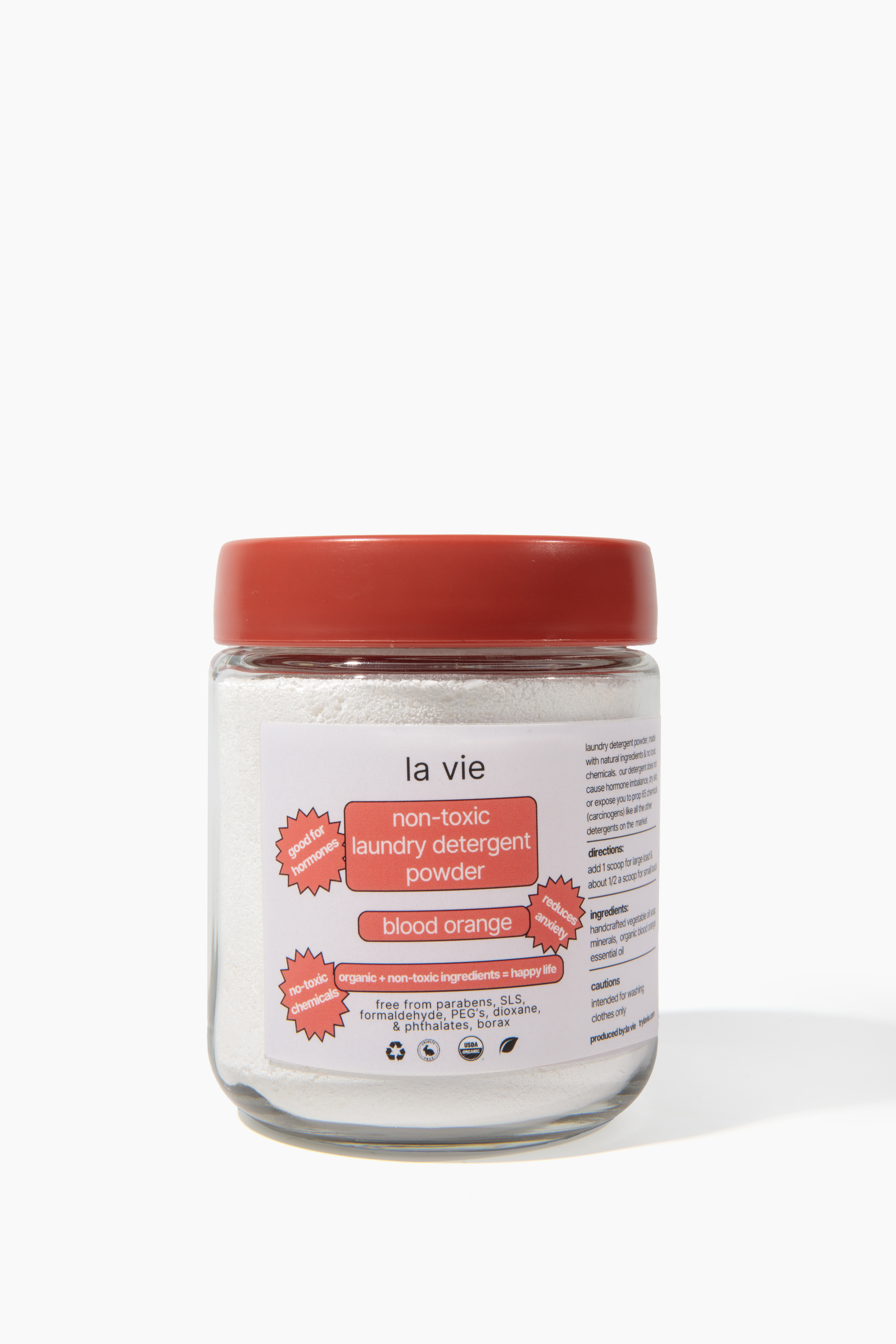 Glass jar with red lid, labeled non-toxic laundry detergent powder.