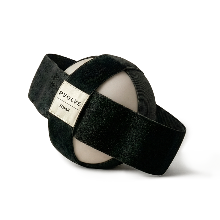 The Pvolve P.ball, an off-white exercise ball with black straps, on a white background.