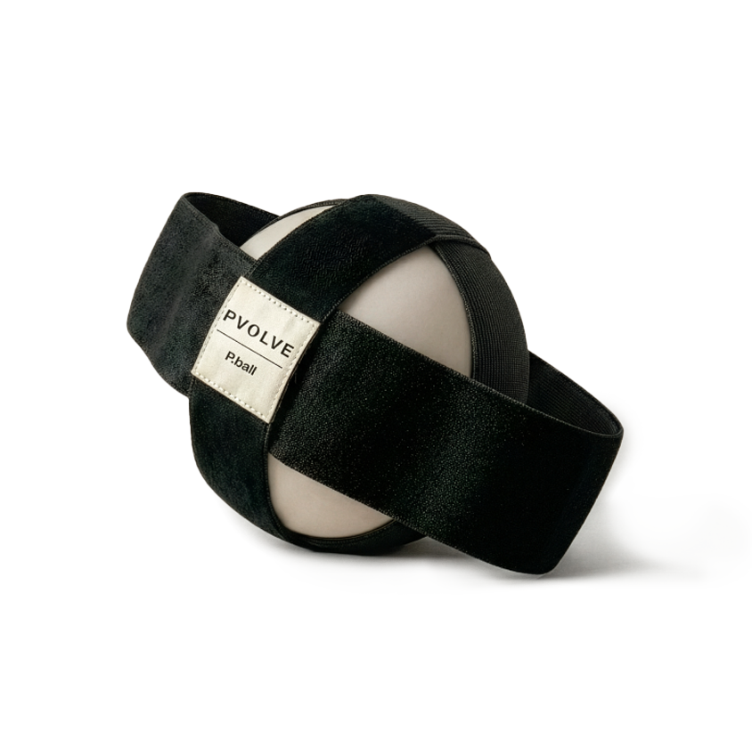 The Pvolve P.ball, an off-white exercise ball with black straps, on a white background.