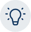 A blue icon of a lit lightbulb inside a light gray circle.