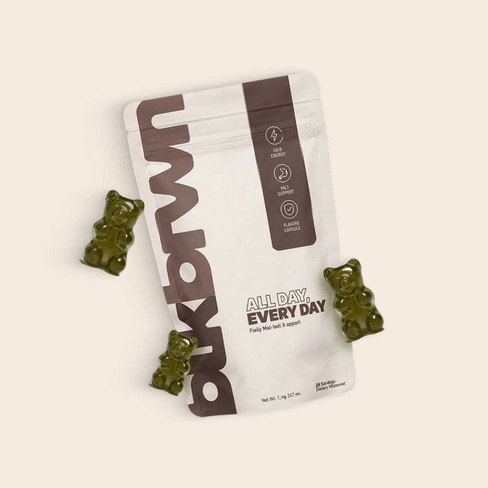 A white pouch of bkbrwn supplements with three green, bear-shaped gummies on a light background.