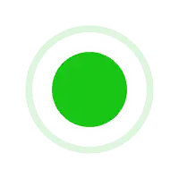 A solid green circle on a black background.