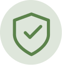 A green icon of a shield with a checkmark inside of a light green circle.