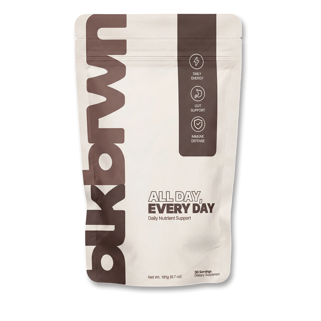 A white and brown pouch of dkbrwn All Day, Every Day daily nutrient support dietary supplement.
