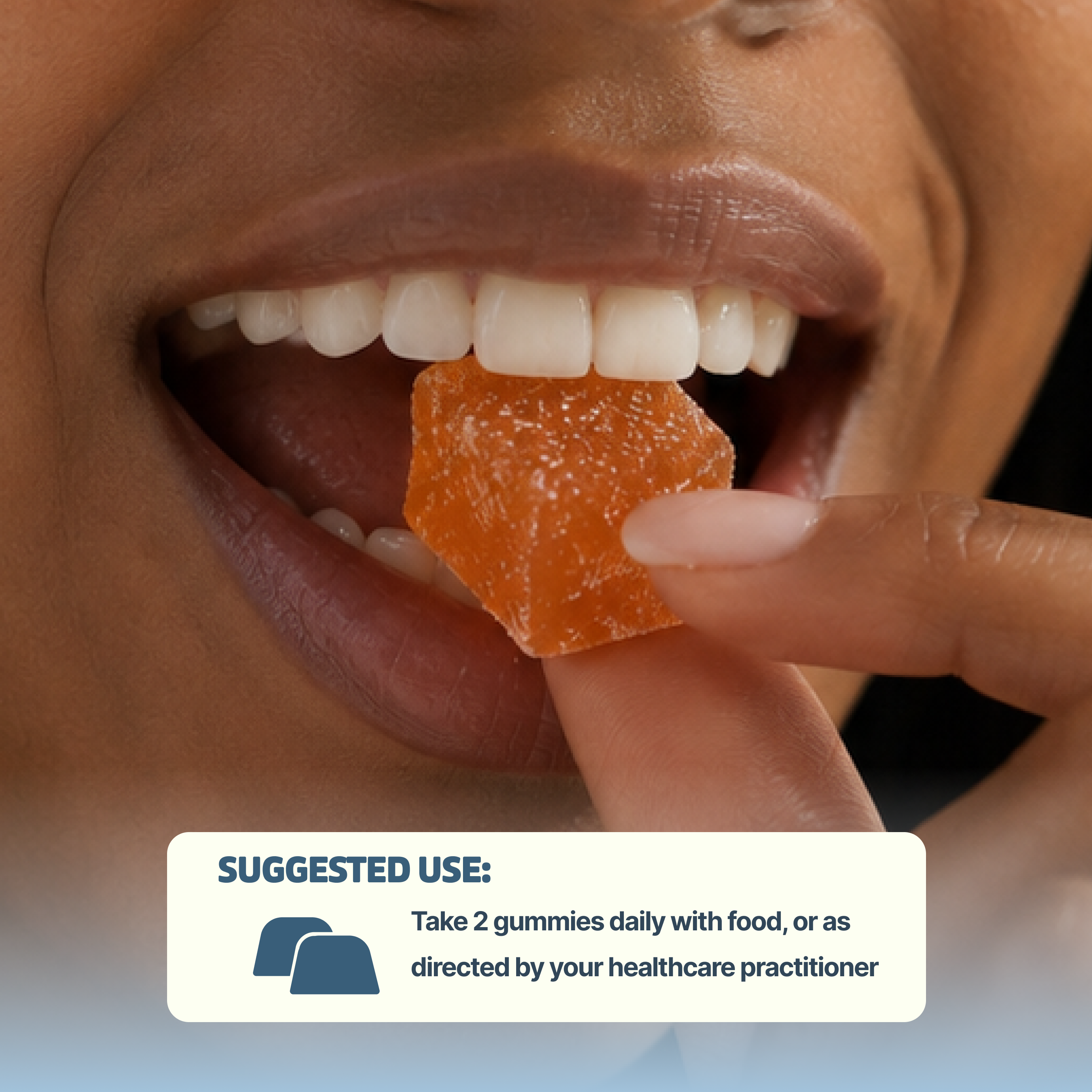 A close-up of a person about to eat an orange gummy, with suggested use instructions below.