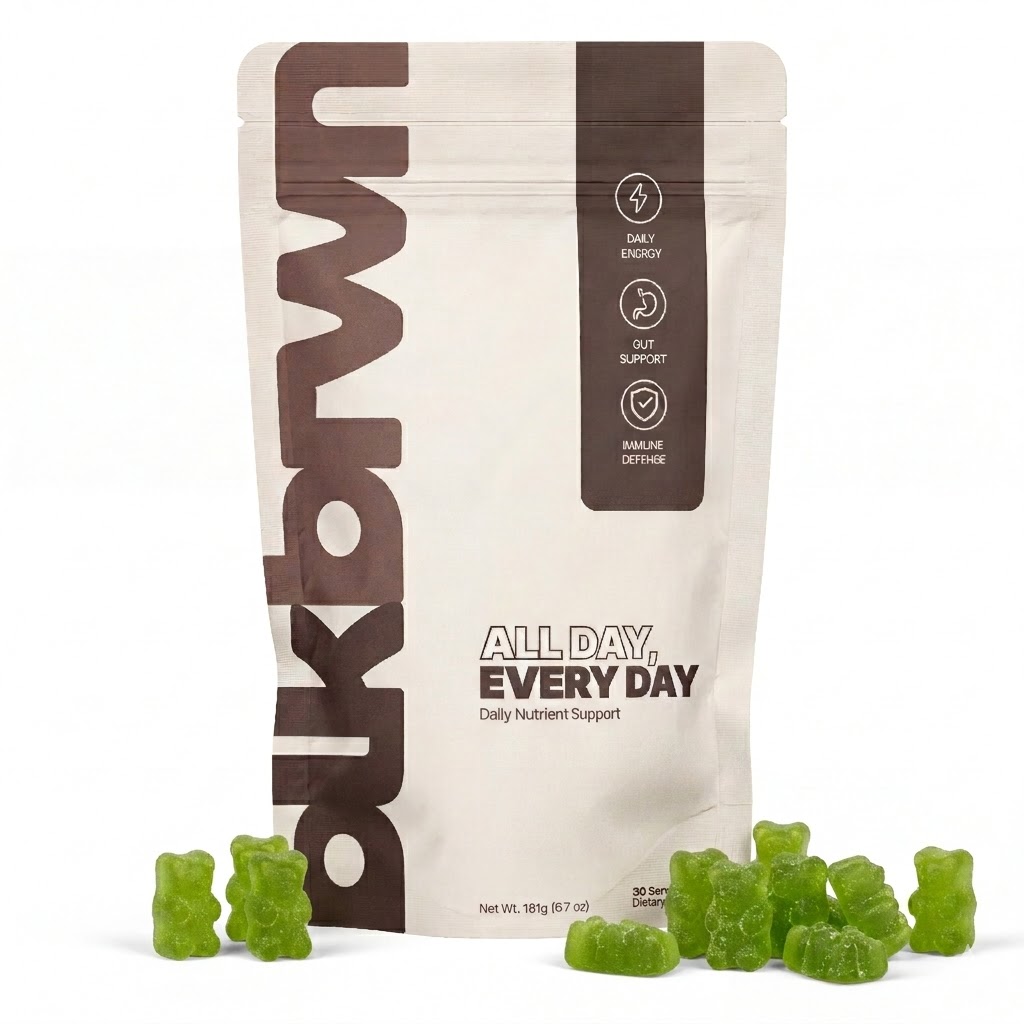 A pouch of Bukbrn daily nutrient support with several green gummy bears in front of it.