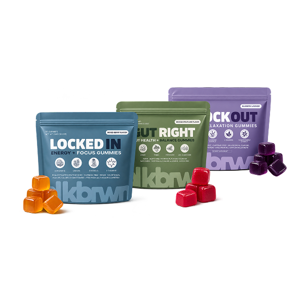 Three different colored pouches of wellness gummies with corresponding loose gummies displayed in front of them.