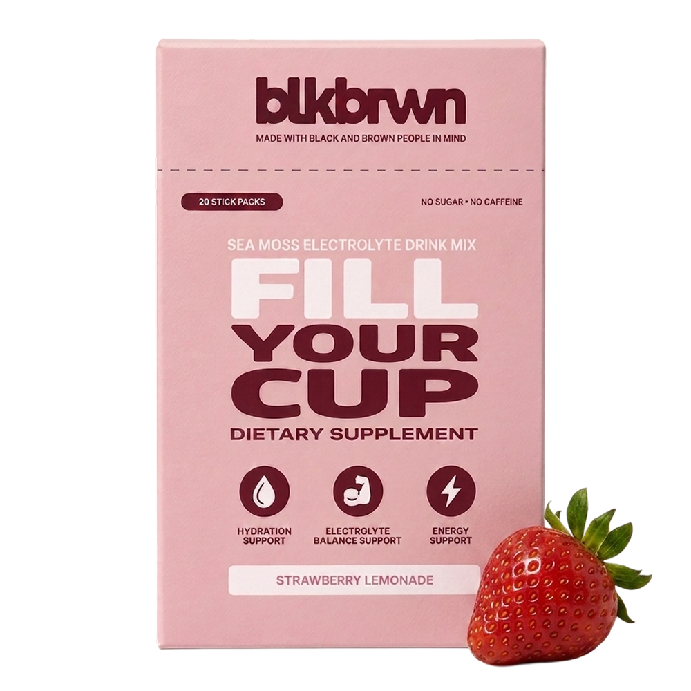 A pink box of blkbrwn Fill Your Cup Strawberry Lemonade dietary supplement next to a fresh strawberry.