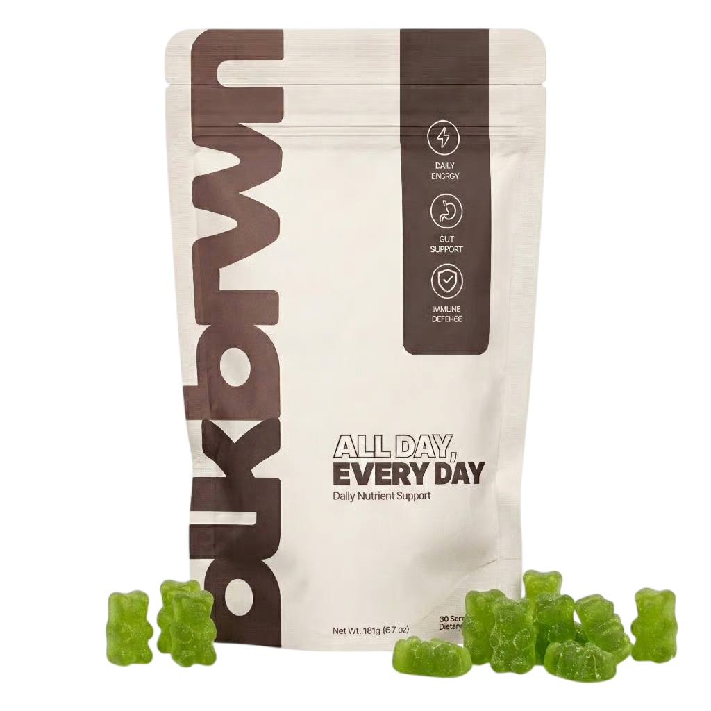 A white and brown pouch of 'All Day, Every Day' nutrient support gummies with green gummy bears in front.