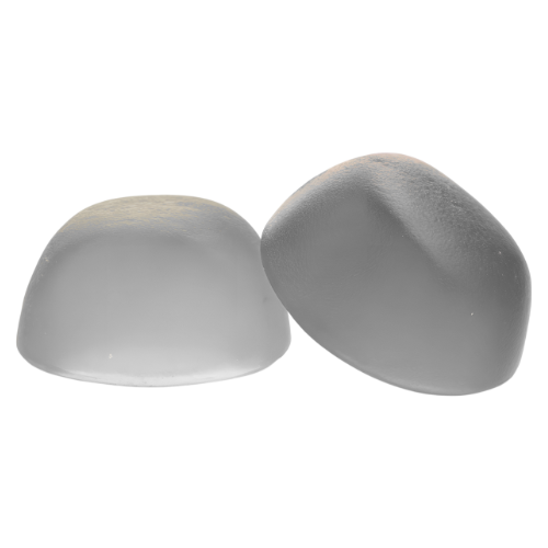 Two translucent, dome-shaped silicone implants on a white background.