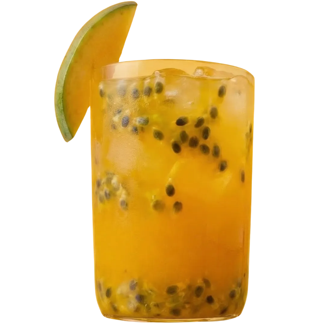 A glass of orange juice garnished with a fresh slice of mango on the rim.