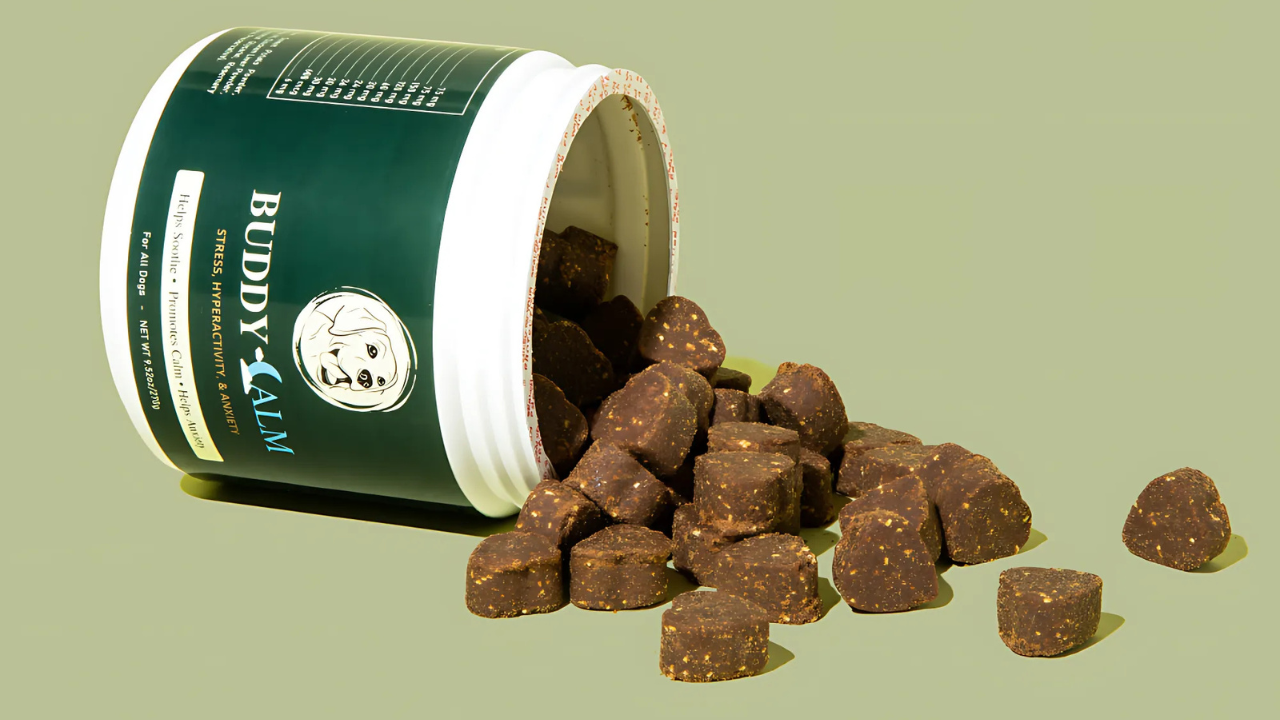 Packaged pet food containers arranged on a wooden surface.