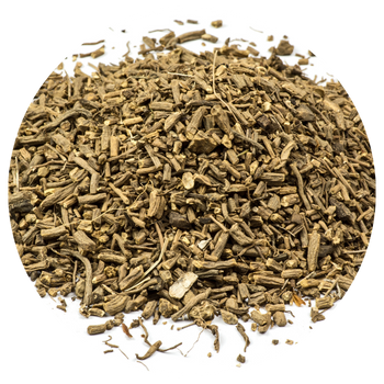 A pile of dried, chopped herbs on a white background.