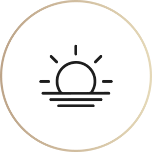 A line art icon of a sun rising or setting over the water, inside a circular border.