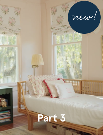 An image of a pink room with a twin bed by a window.