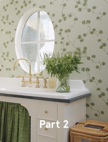 A photo of a laundry room with green floral wallpaper