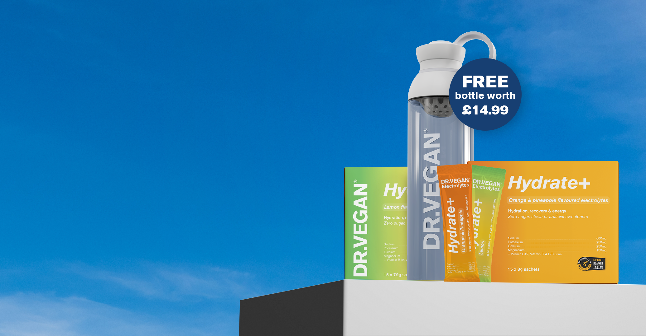 Dr. Vegan electrolyte sachets and bottle with blue sky background.