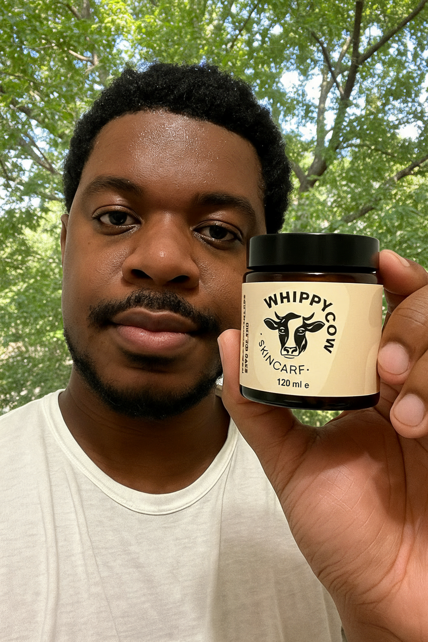 Person holding a jar labeled 'Whippy Cow Skincare' with a cow logo.