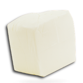 A block of white tofu on a white background.